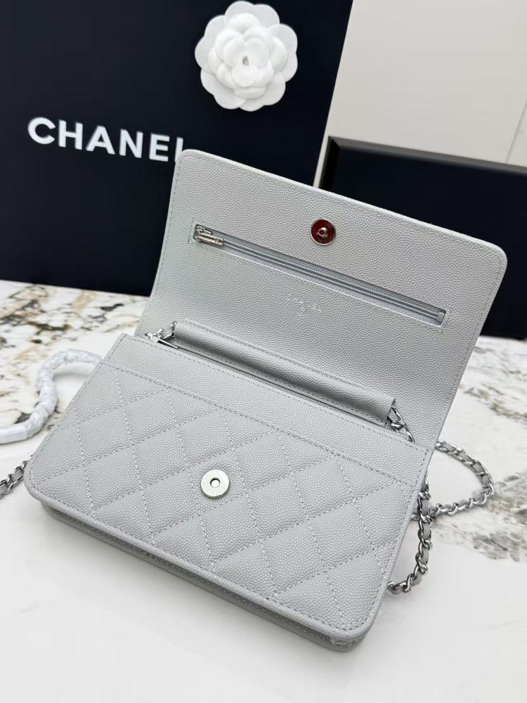 Chanel Wallet on Chain (WOC) crafted in light grey caviar leather with silver-tone hardware.