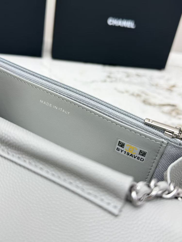 Chanel Wallet on Chain (WOC) crafted in light grey caviar leather with silver-tone hardware.