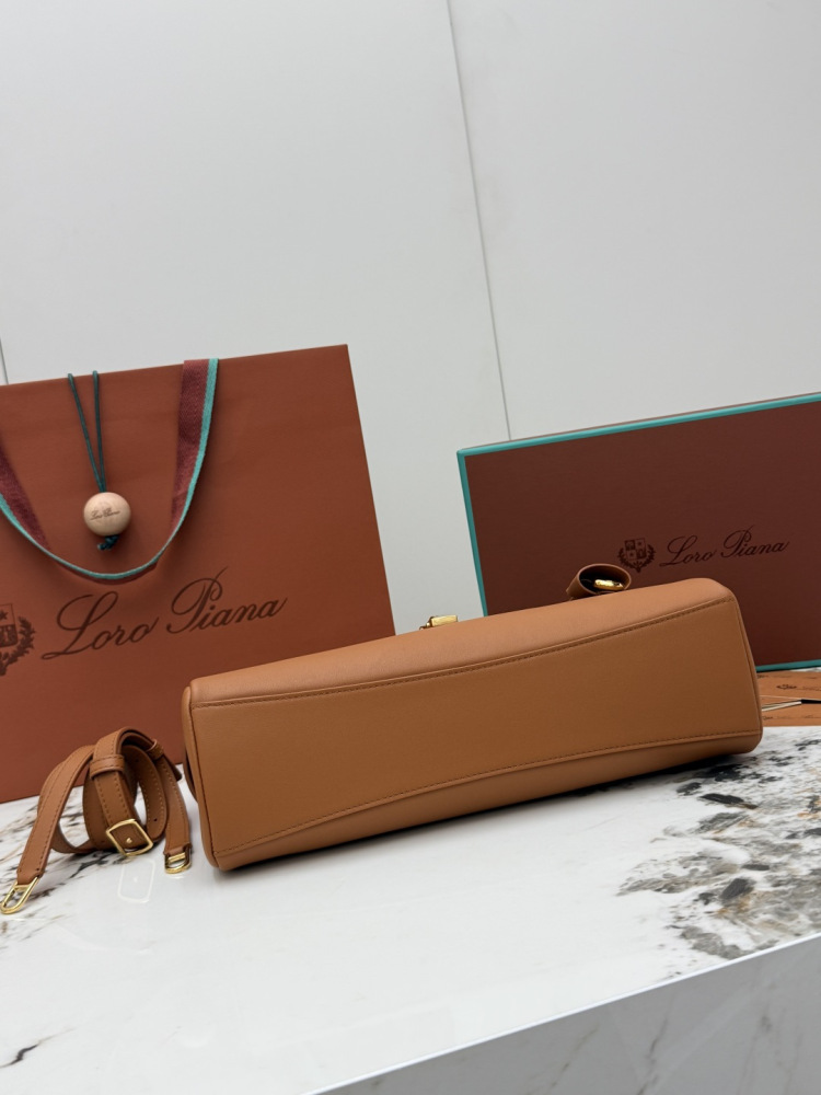 Loro Piana Extra Softy Bag LP33, also known as the "Lunch Box Bag", crafted in warm brown smooth leather with gold-tone hardware.