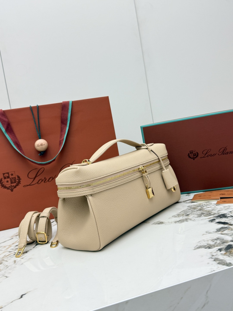 Loro Piana Extra Pocket L19 handbag, crafted in milk tea beige grained leather with gold-tone hardware.