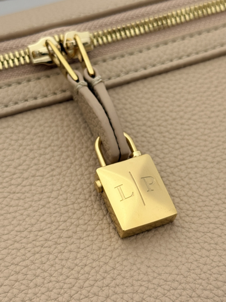 Loro Piana Extra Pocket L19 handbag, crafted in milk tea beige grained leather with gold-tone hardware.