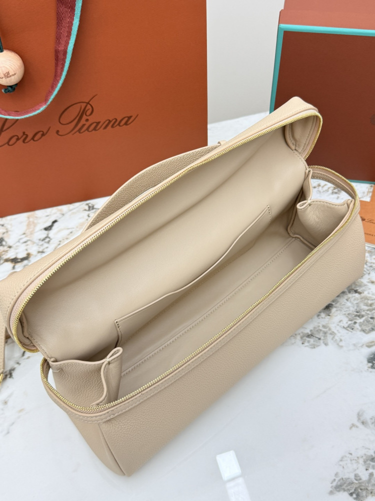 Loro Piana Extra Pocket L19 handbag, crafted in milk tea beige grained leather with gold-tone hardware.