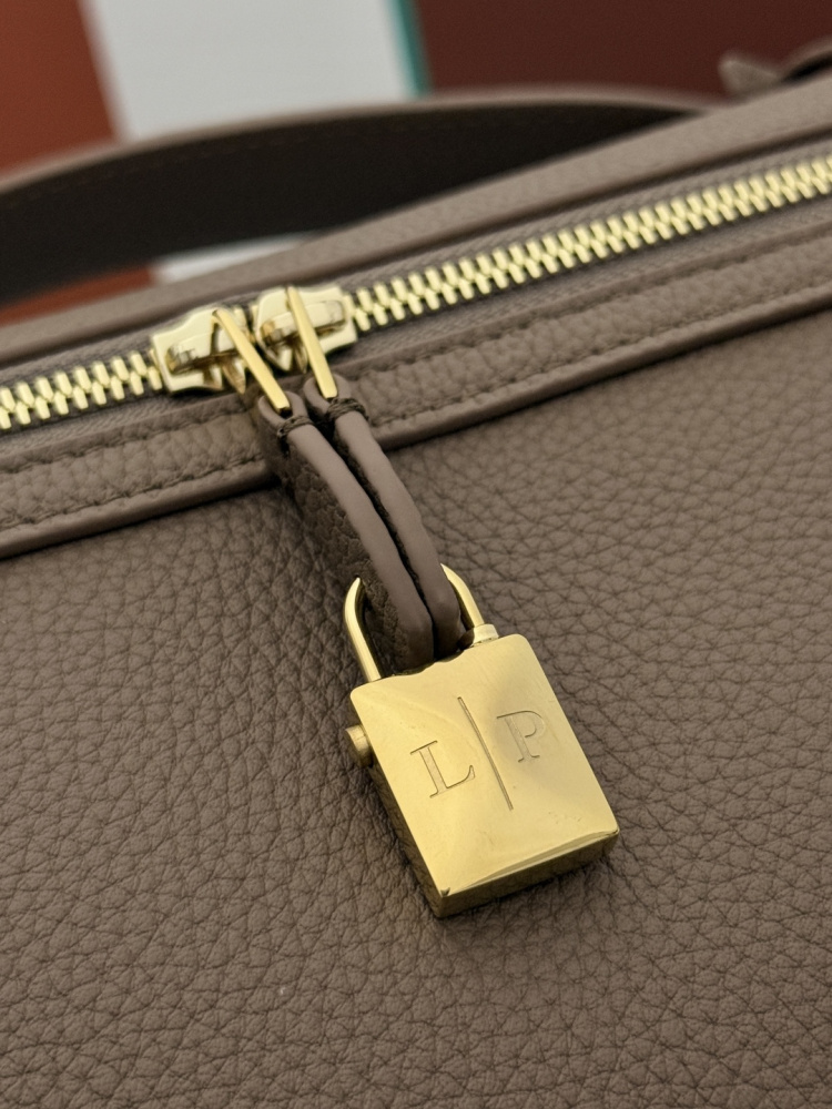 Loro Piana Extra Pocket L19 handbag, crafted in elephant grey grained leather with gold-tone hardware.