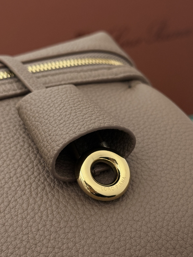 Loro Piana Extra Pocket L19 handbag, crafted in elephant grey grained leather with gold-tone hardware.