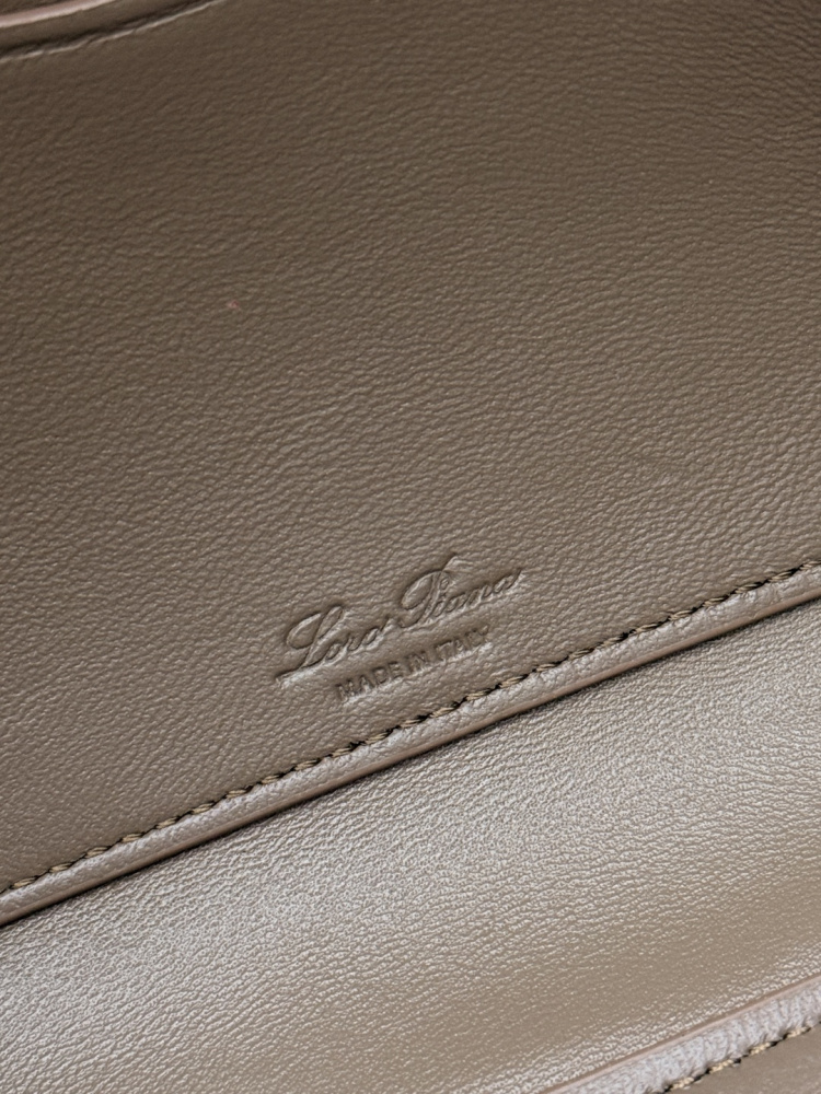 Loro Piana Extra Pocket L19 handbag, crafted in elephant grey grained leather with gold-tone hardware.