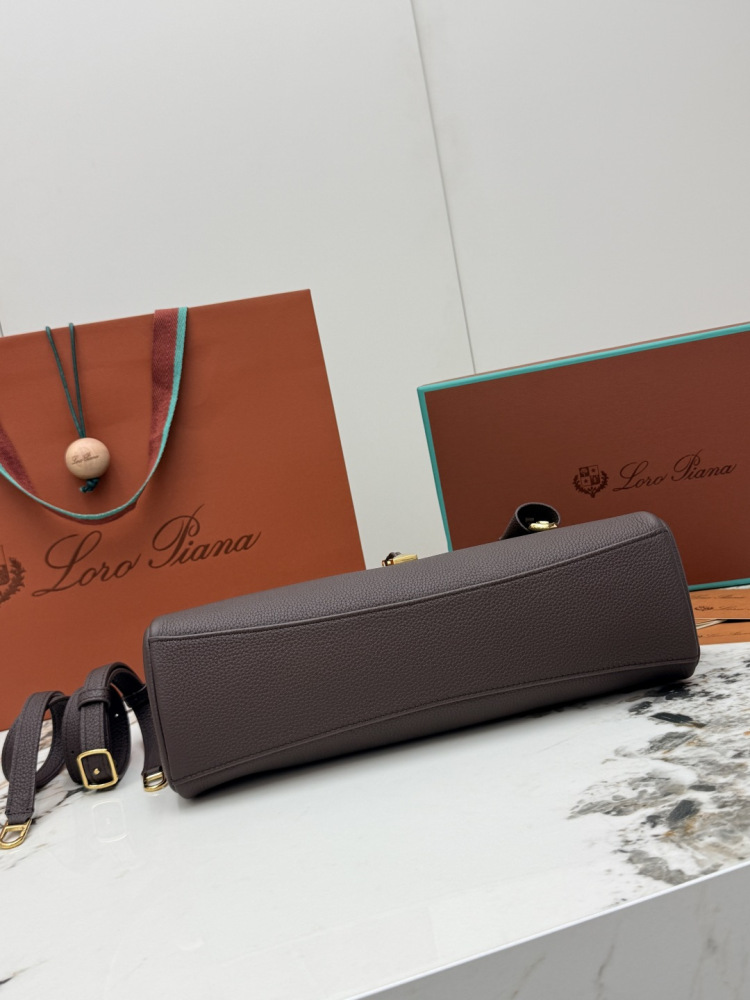Loro Piana Extra Pocket handbag, crafted in dark brown grained leather with gold-tone hardware.