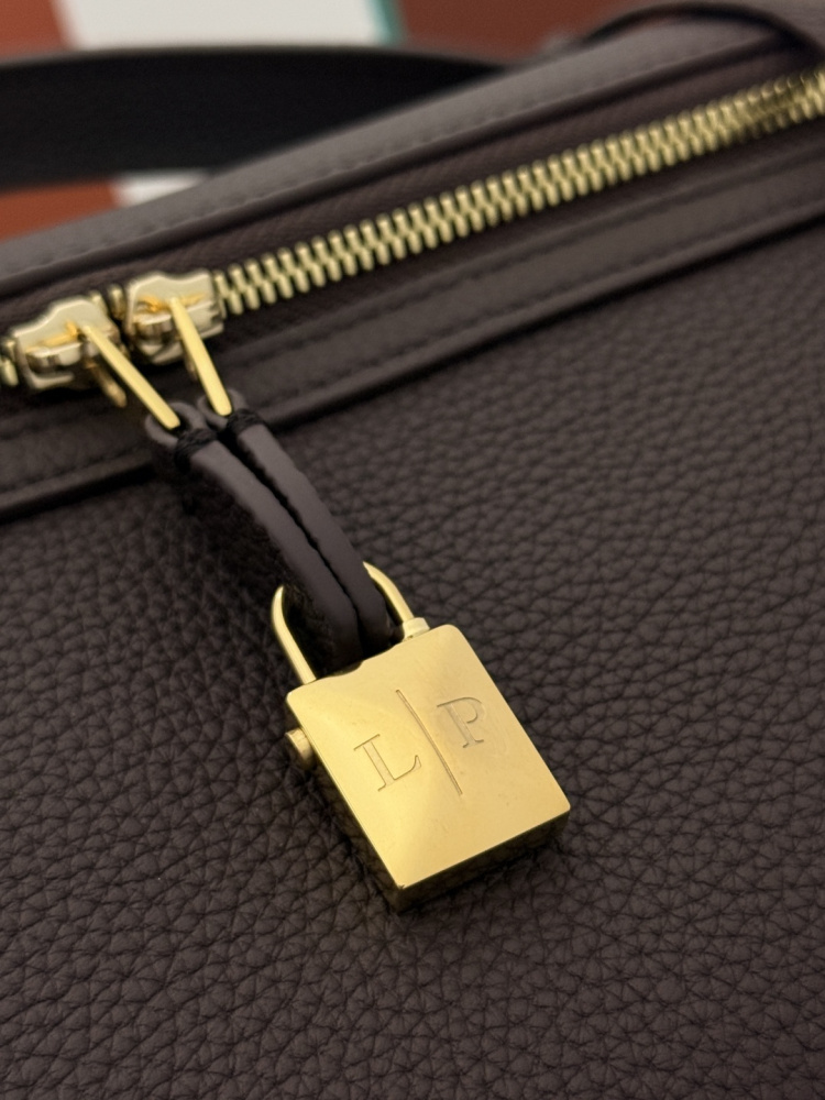 Loro Piana Extra Pocket handbag, crafted in dark brown grained leather with gold-tone hardware.