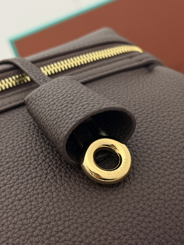 Loro Piana Extra Pocket handbag, crafted in dark brown grained leather with gold-tone hardware.