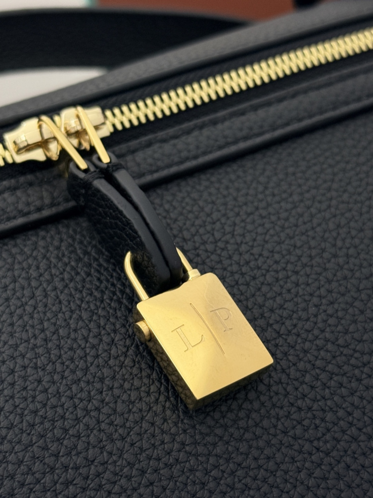 Loro Piana Extra Pocket L19 handbag, crafted in black grained leather with gold-tone hardware.