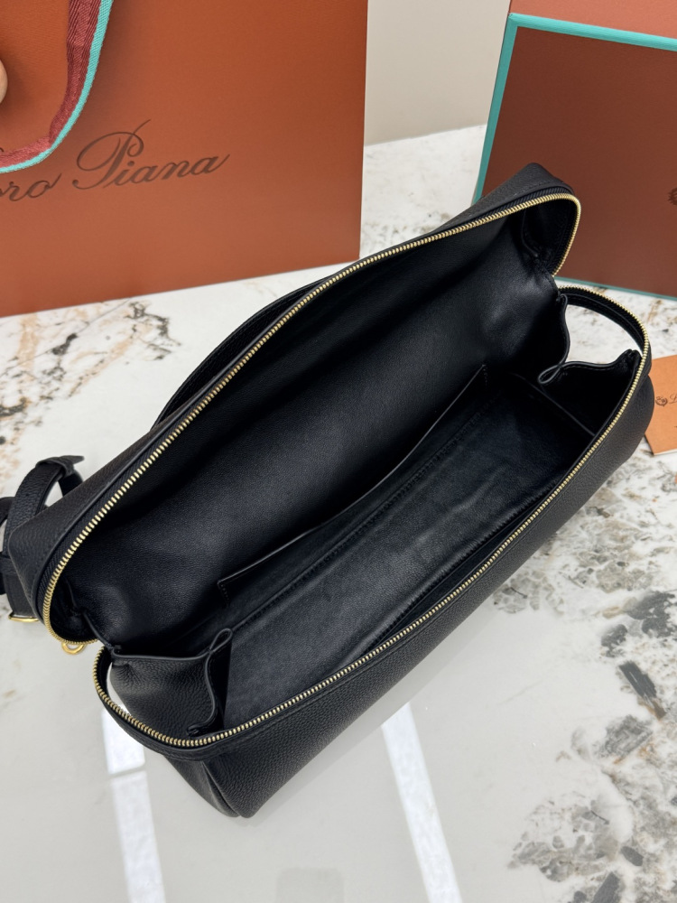 Loro Piana Extra Pocket L19 handbag, crafted in black grained leather with gold-tone hardware.