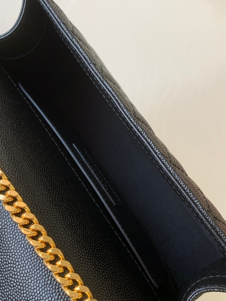 This is a quilted envelope bag from YSL, crafted in black caviar leather with a gold-tone logo and metal chain strap, suitable for shoulder or crossbody wear.