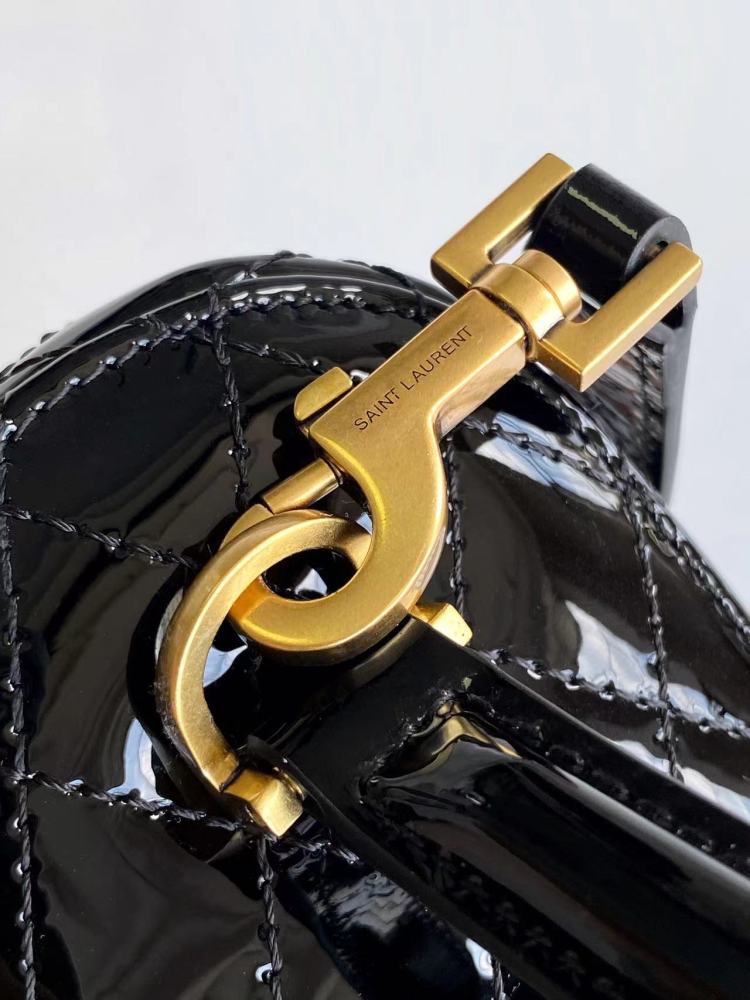 This is a quilted cosmetic bag from YSL, crafted in black patent leather with a gold-tone logo and detachable strap, suitable for hand-held or shoulder wear.