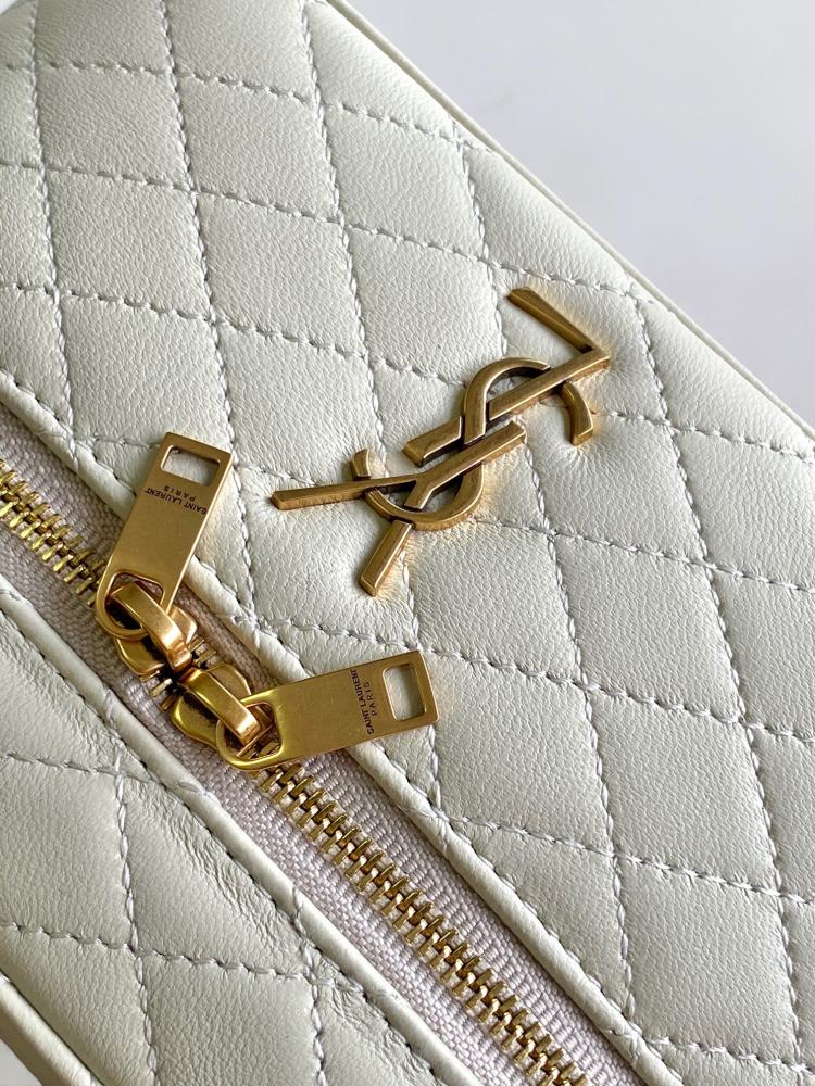 This is a quilted cosmetic bag from YSL, crafted in off-white grained leather with a gold-tone logo and detachable strap, suitable for hand-held or shoulder wear.
