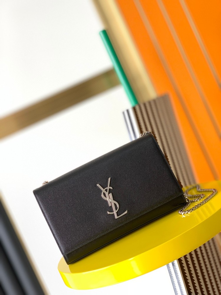 This bag is the classic YSL (Yves Saint Laurent) Kate shoulder bag. It features black caviar leather (pebbled leather) with the iconic silver-tone YSL logo and a silver-tone metal chain.