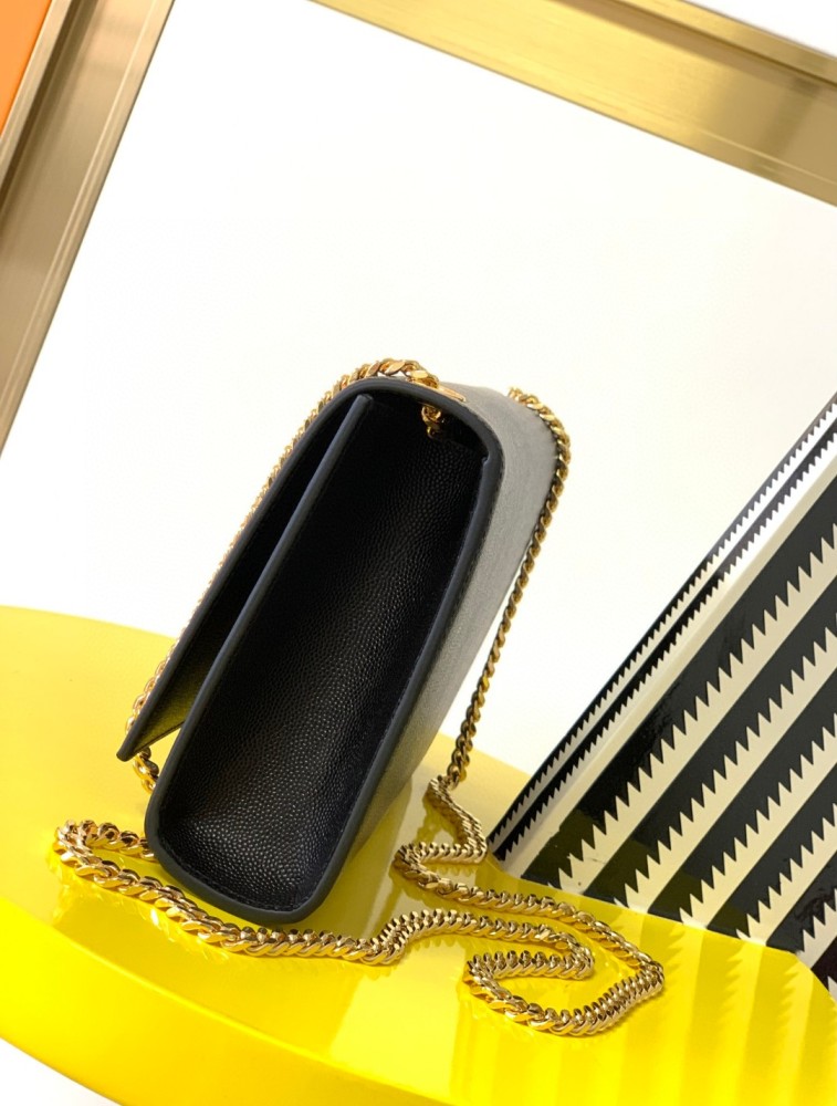 This is the YSL Kate chain bag, crafted in black caviar leather with a gold-tone metal logo and chain strap, no tassel, suitable for shoulder or crossbody wear.