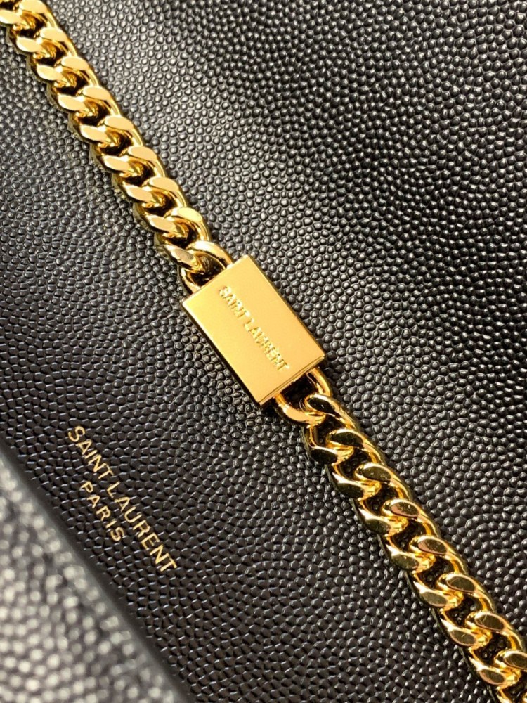 This is the YSL Kate chain bag, crafted in black caviar leather with a gold-tone metal logo and chain strap, no tassel, suitable for shoulder or crossbody wear.
