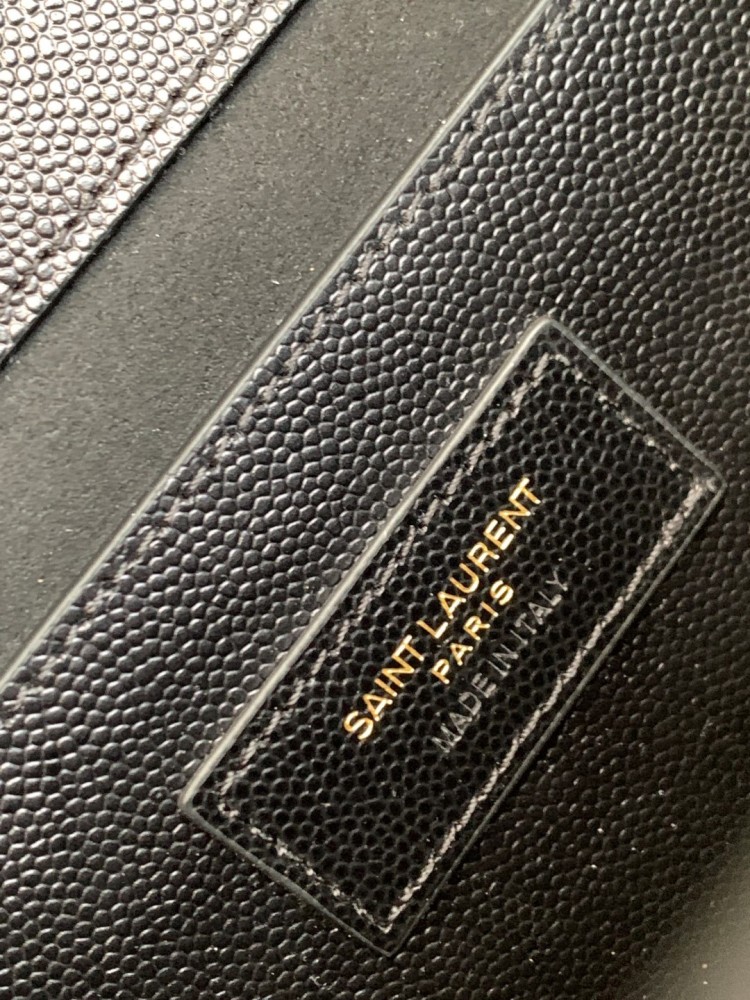This is the YSL Kate chain bag, crafted in black caviar leather with a gold-tone metal logo and chain strap, no tassel, suitable for shoulder or crossbody wear.