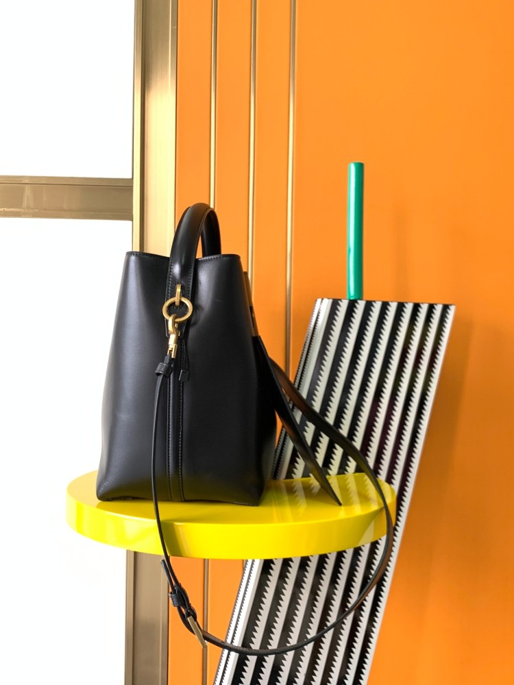 This is a classic shoulder bag from the YSL (Yves Saint Laurent) Kate collection. It is crafted from black pebbled leather, paired with the iconic gold-tone YSL logo and a gold-tone metal chain.