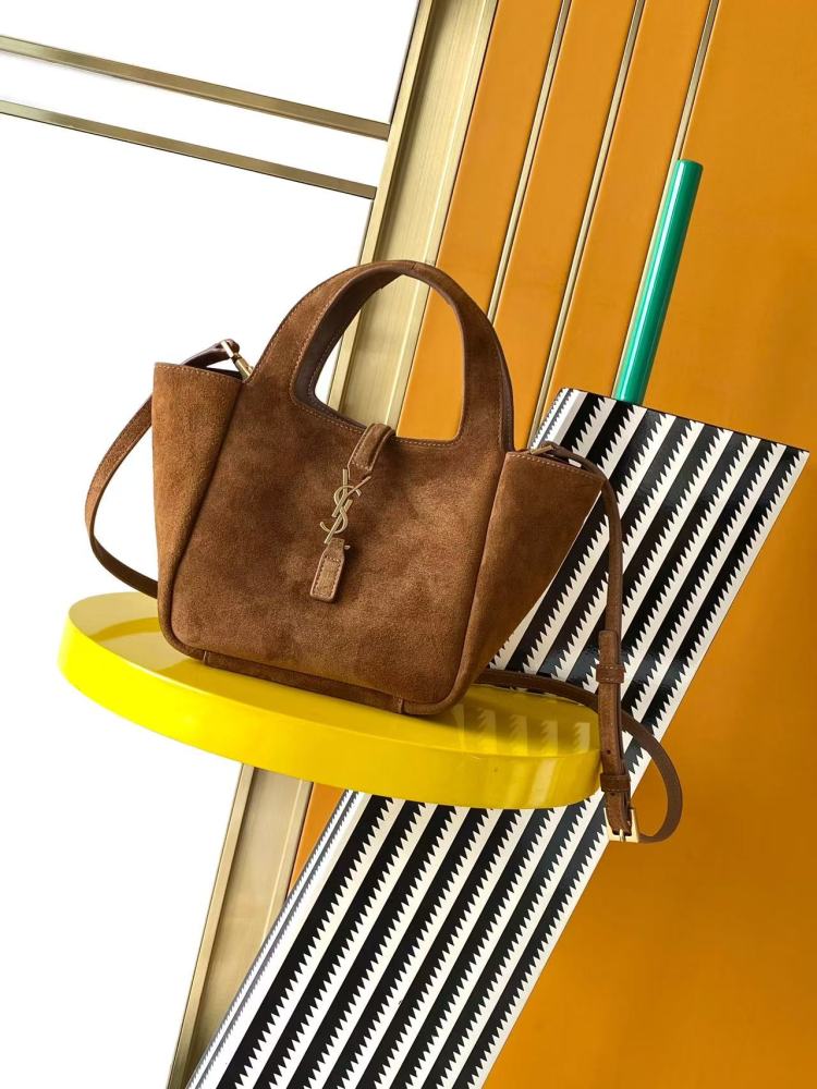 and the iconic gold-tone YSL logo, showcasing a sleek and sophisticated style suitable for both daily and formal occasions.