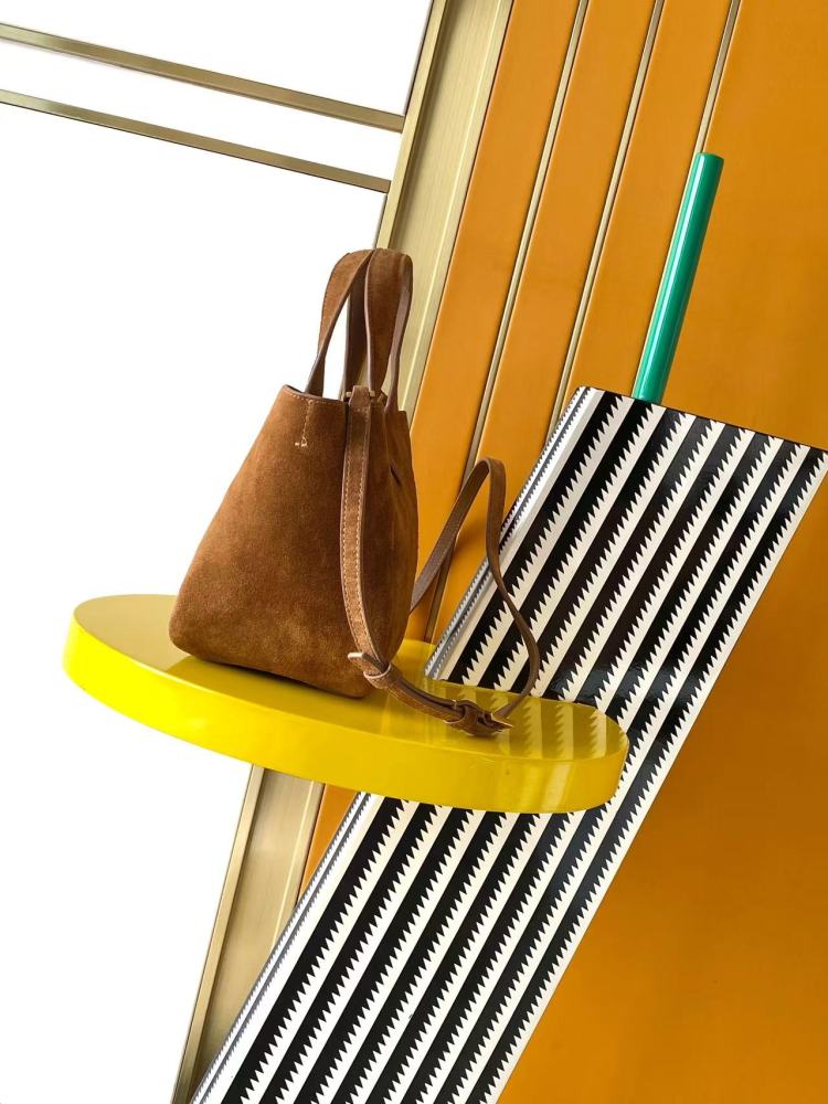 and the iconic gold-tone YSL logo, showcasing a sleek and sophisticated style suitable for both daily and formal occasions.