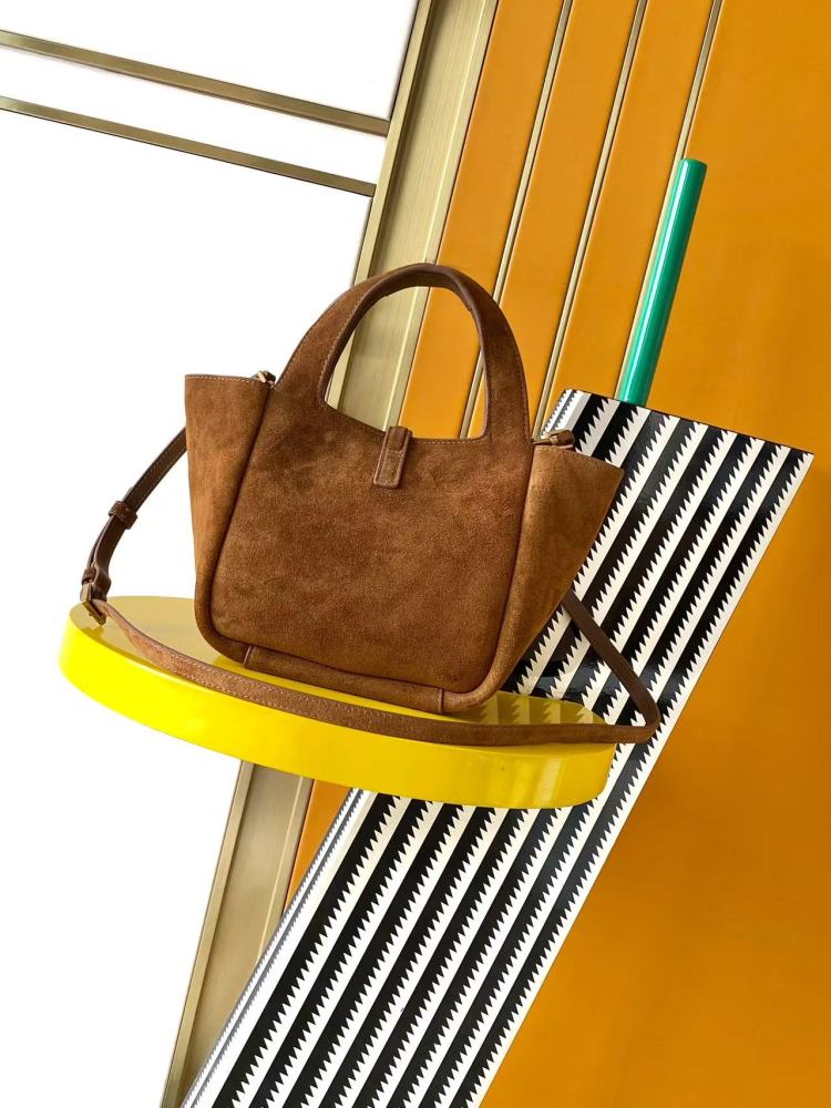 and the iconic gold-tone YSL logo, showcasing a sleek and sophisticated style suitable for both daily and formal occasions.