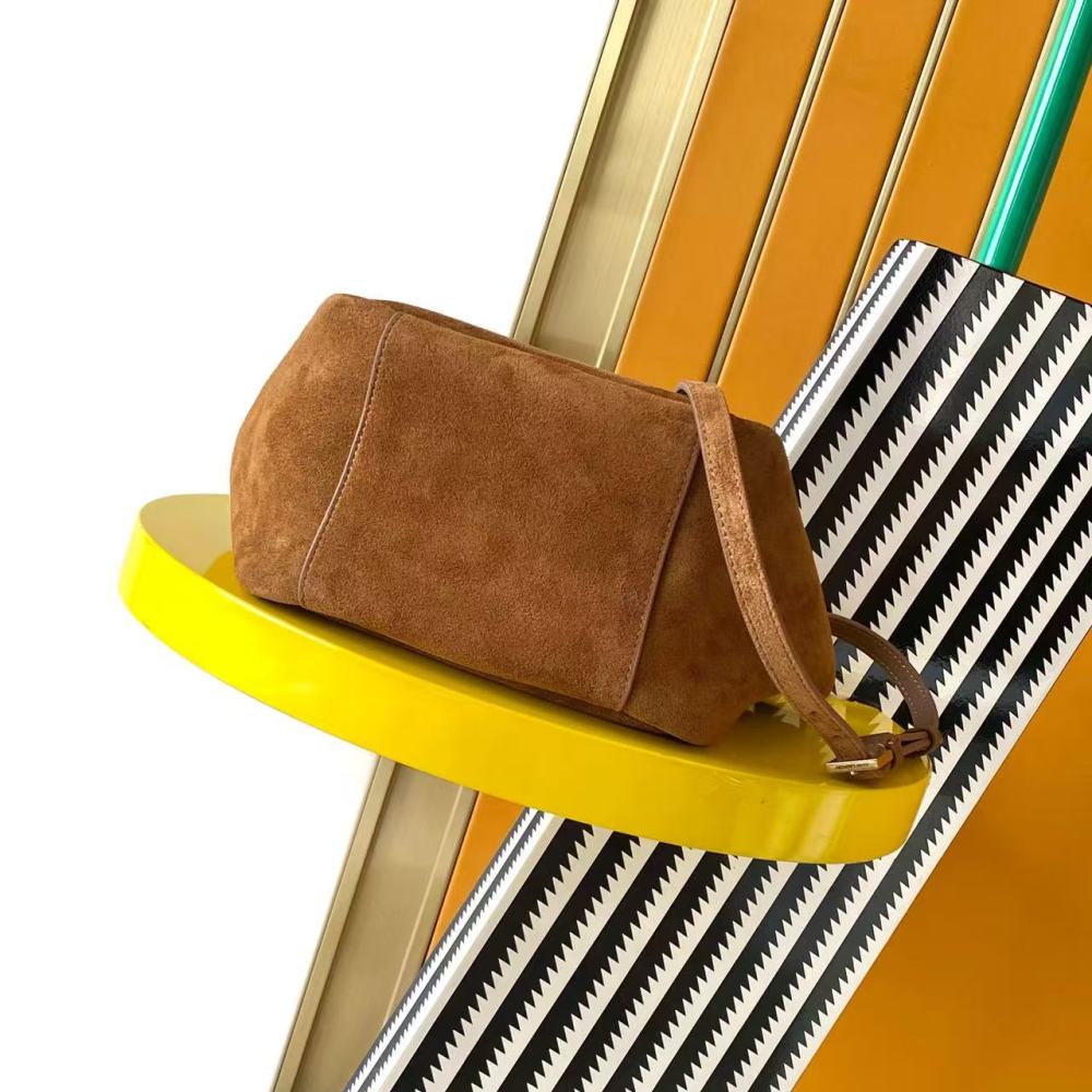and the iconic gold-tone YSL logo, showcasing a sleek and sophisticated style suitable for both daily and formal occasions.