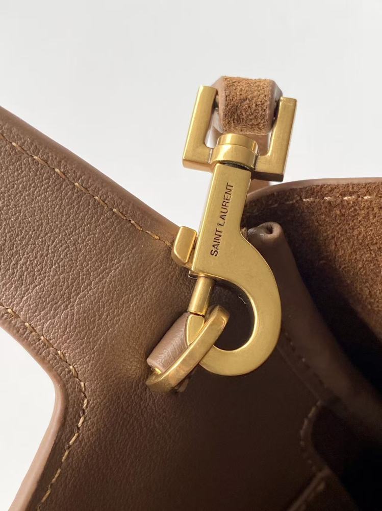 and the iconic gold-tone YSL logo, showcasing a sleek and sophisticated style suitable for both daily and formal occasions.