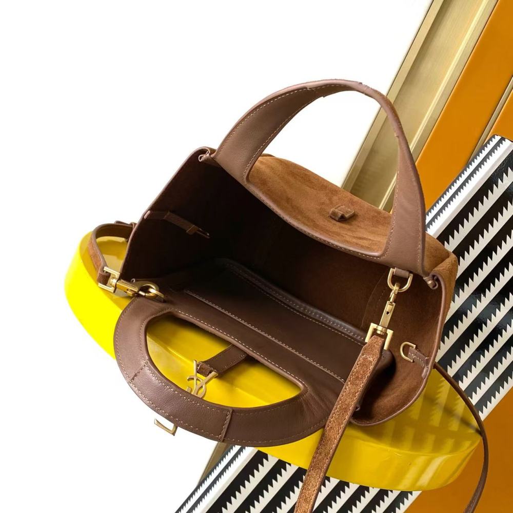 and the iconic gold-tone YSL logo, showcasing a sleek and sophisticated style suitable for both daily and formal occasions.