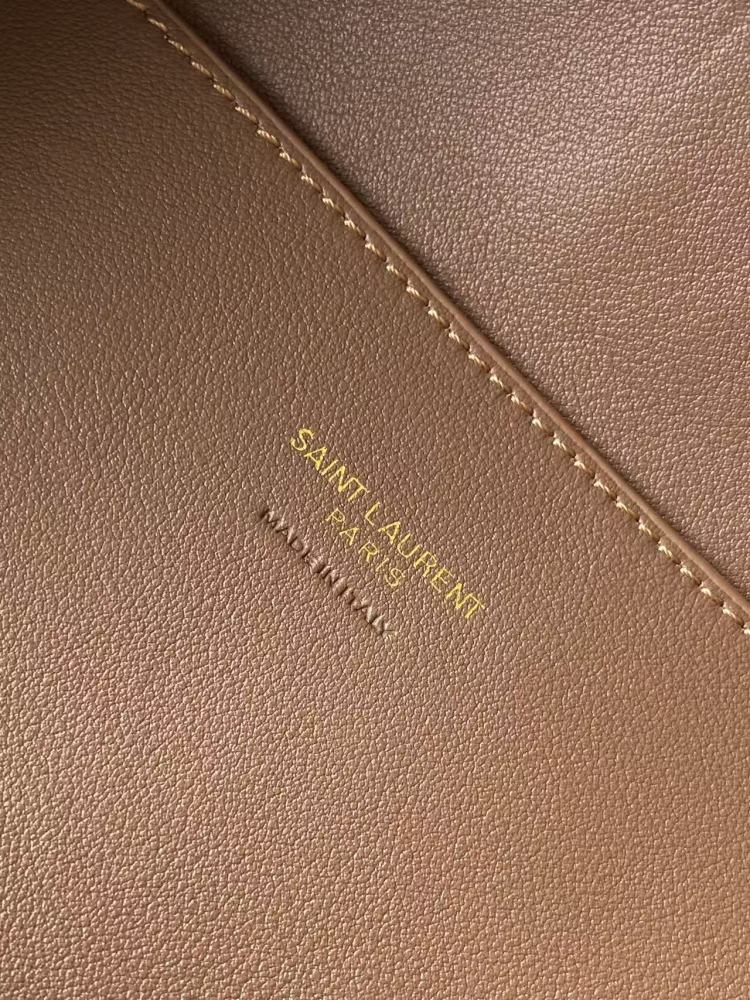 and the iconic gold-tone YSL logo, showcasing a sleek and sophisticated style suitable for both daily and formal occasions.