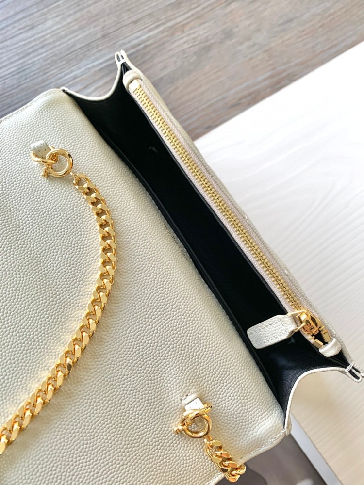 This is the YSL Cassandre chain wallet, crafted from white grained leather with quilted detailing and a gold-tone metal YSL logo on the front. It can be worn as a shoulder or crossbody bag, combining practicality with brand recognition.