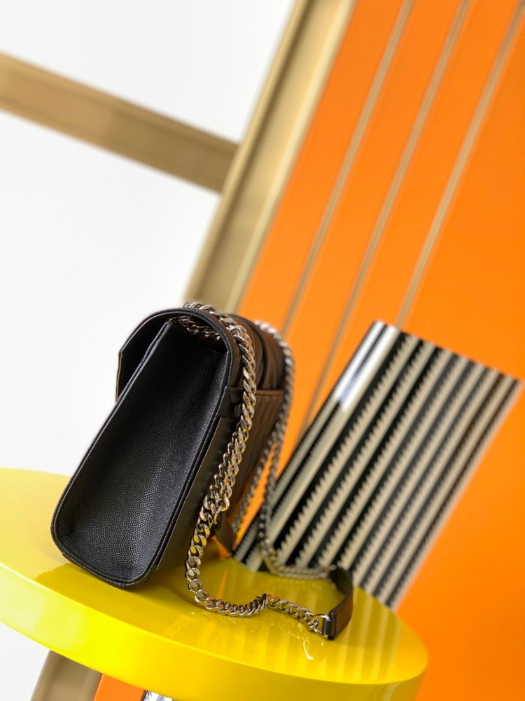 This is the YSL Envelope chain bag, crafted from black grained quilted leather with a silver-tone metal YSL logo, suitable for shoulder or crossbody wear.