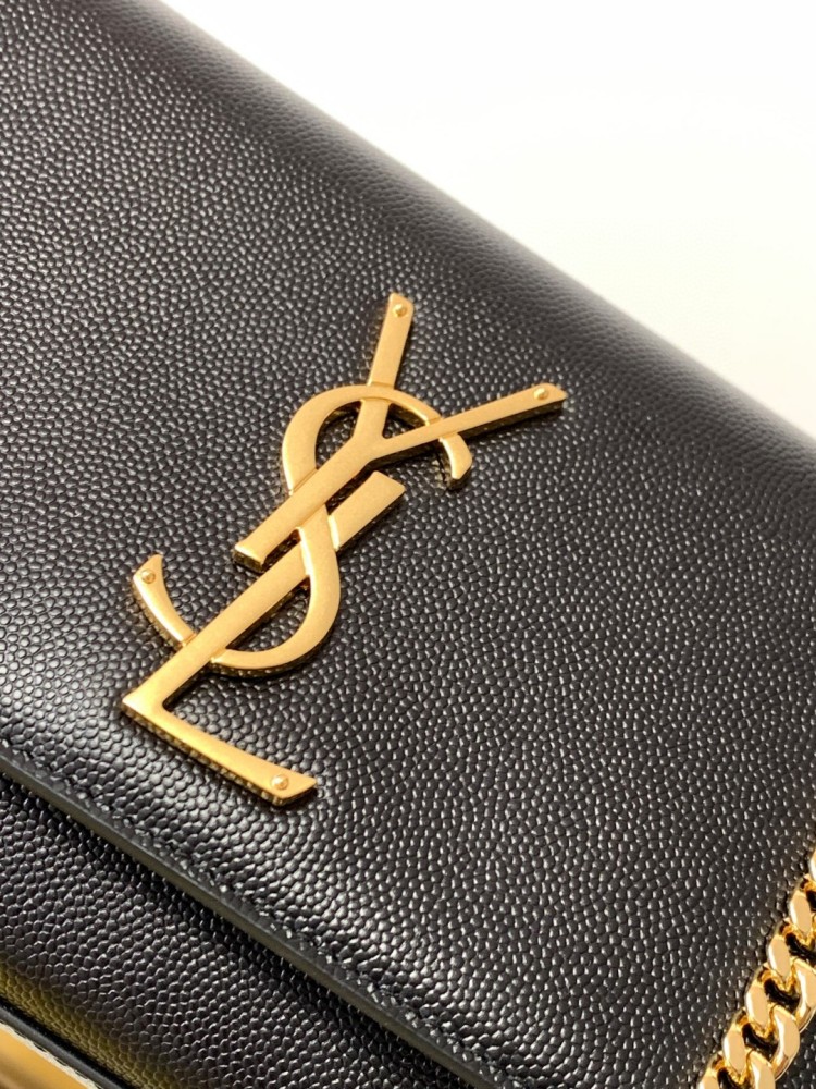 This is a chain bag from the YSL (Yves Saint Laurent) Kate collection, crafted from black grained leather with a prominent gold-tone metal YSL logo on the front. It features a sleek and sophisticated design, suitable for shoulder or crossbody wear.