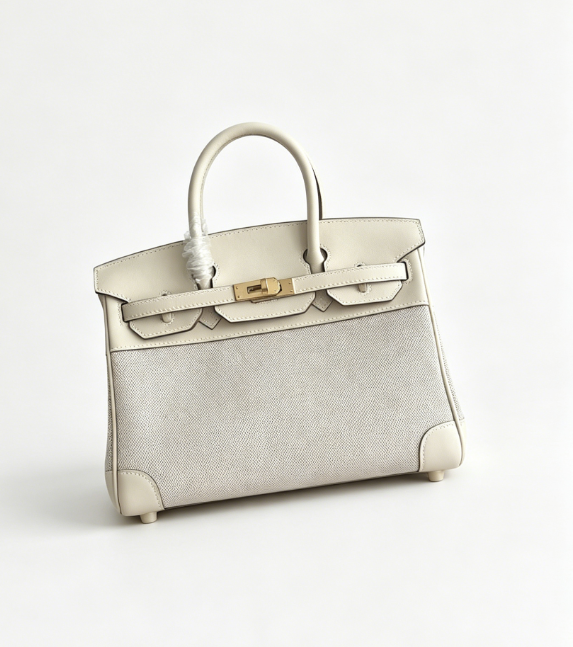 The classic Hermès Birkin bag, specifically the Birkin 25 canvas and leather version, is a popular Hermès "patchwork/canvas and leather" version.