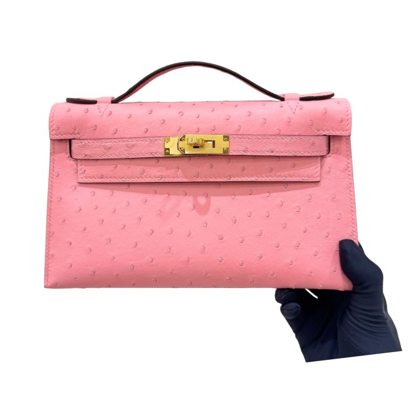 The Hermès Mini Kelly I (also known as the Kelly Pochette) Ostrich Leather Handbag is one of the brand's classic exotic leather models.