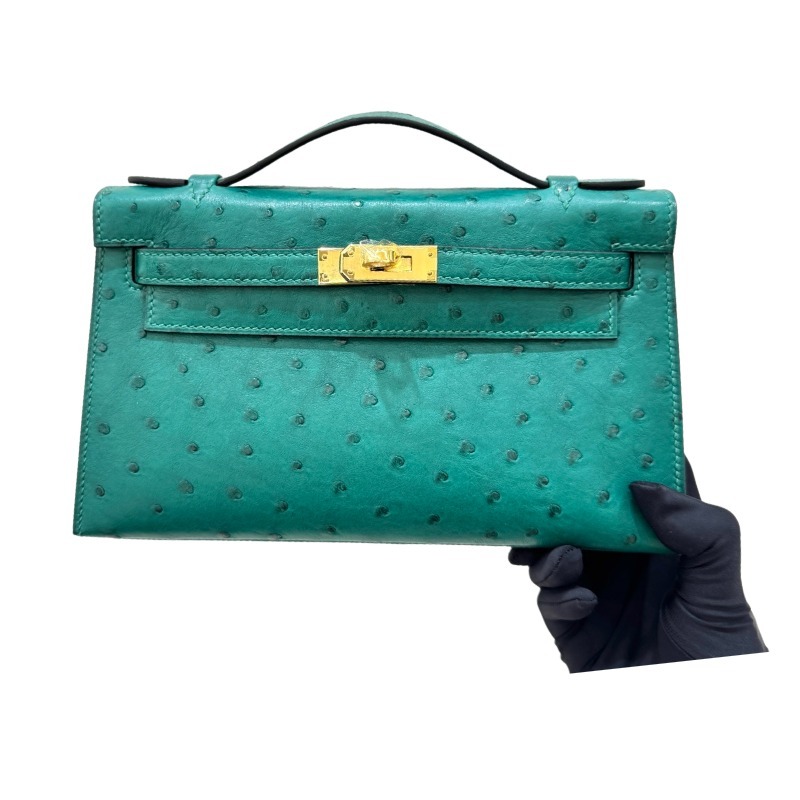The Hermès Mini Kelly I (also known as the Kelly Pochette) Ostrich Leather Handbag is one of the brand's classic exotic leather models.