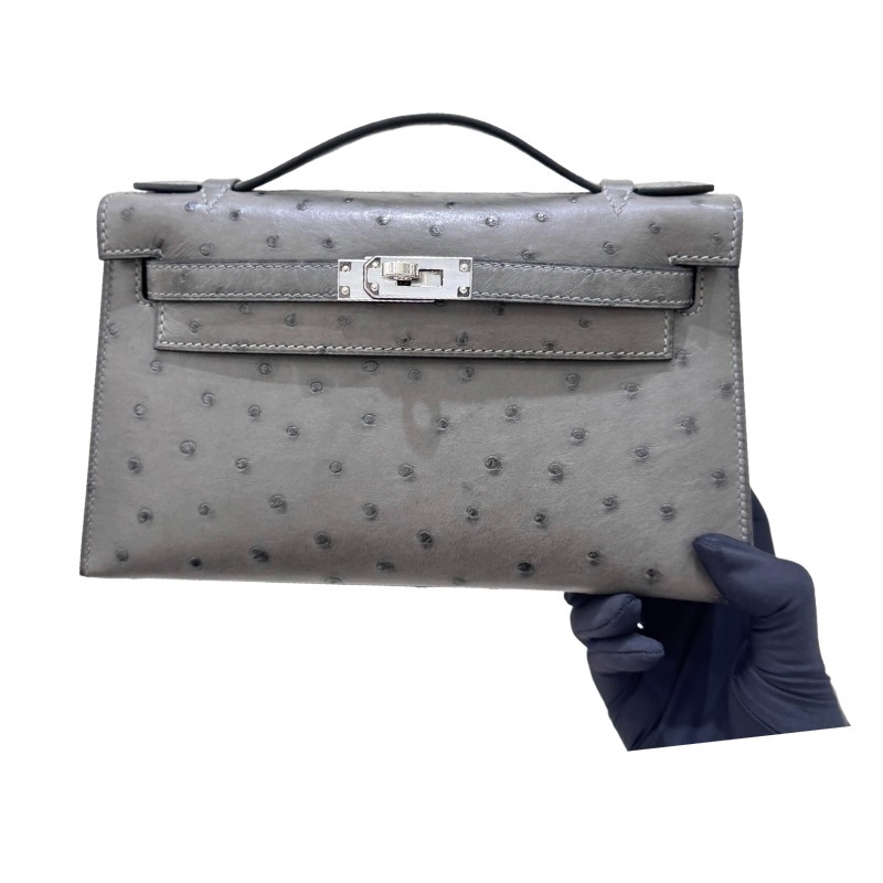 The Hermès Mini Kelly I (also known as the Kelly Pochette) Ostrich Leather Handbag is one of the brand's classic exotic leather models.