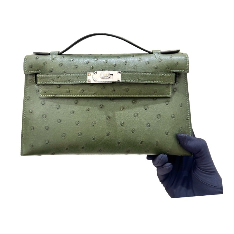 The Hermès Mini Kelly I (also known as the Kelly Pochette) Ostrich Leather Handbag is one of the brand's classic exotic leather models.