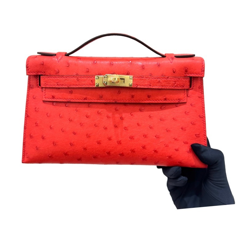 The Hermès Mini Kelly I (also known as the Kelly Pochette) Ostrich Leather Handbag is one of the brand's classic exotic leather models.
