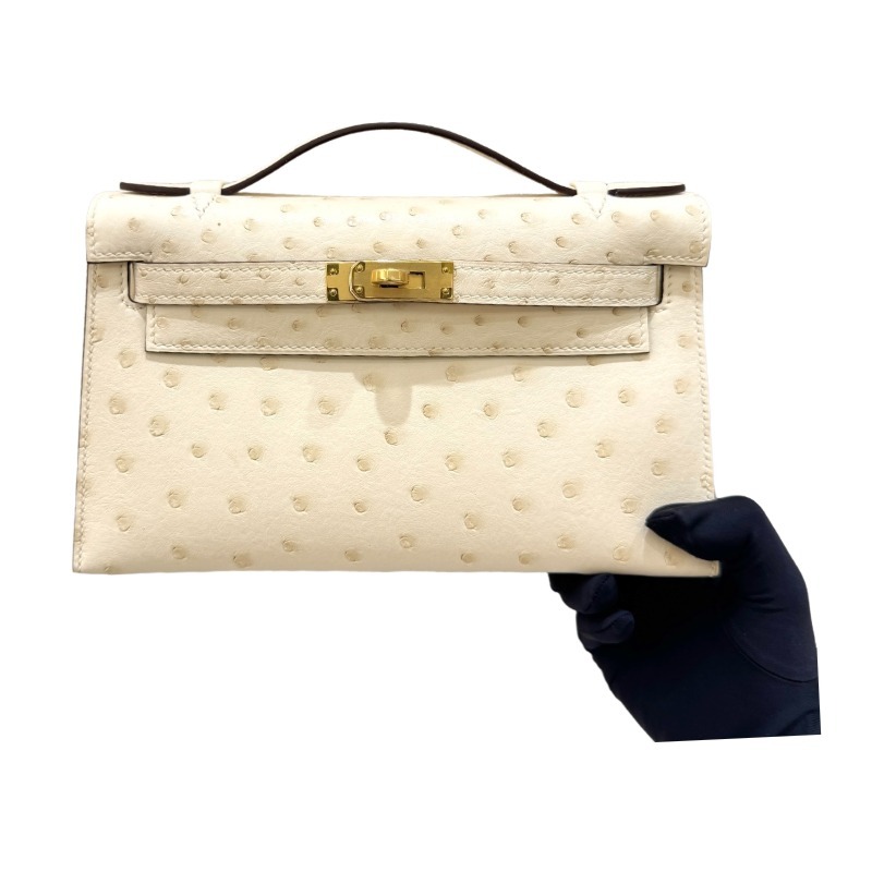 The Hermès Mini Kelly I (also known as the Kelly Pochette) Ostrich Leather Handbag is one of the brand's classic exotic leather models.