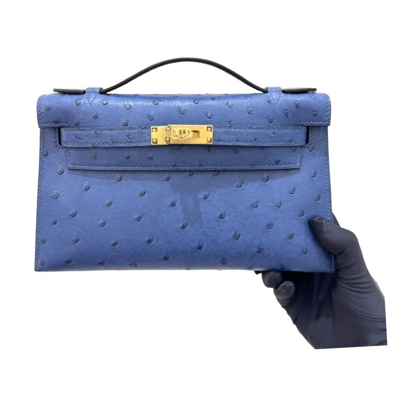 The Hermès Mini Kelly I (also known as the Kelly Pochette) Ostrich Leather Handbag is one of the brand's classic exotic leather models.