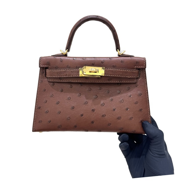The Hermès Mini Kelly I (also known as the Kelly Pochette) Ostrich Leather Handbag is one of the brand's classic exotic leather models.