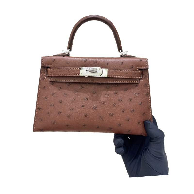 The Hermès Mini Kelly I (also known as the Kelly Pochette) Ostrich Leather Handbag is one of the brand's classic exotic leather models.