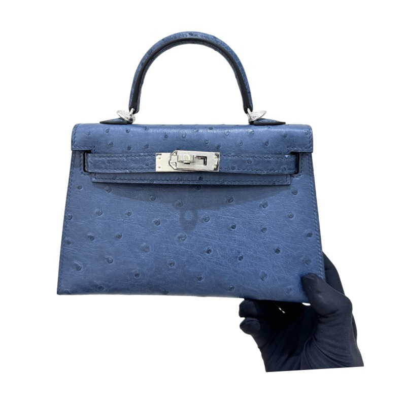 The Hermès Mini Kelly I (also known as the Kelly Pochette) Ostrich Leather Handbag is one of the brand's classic exotic leather models.
