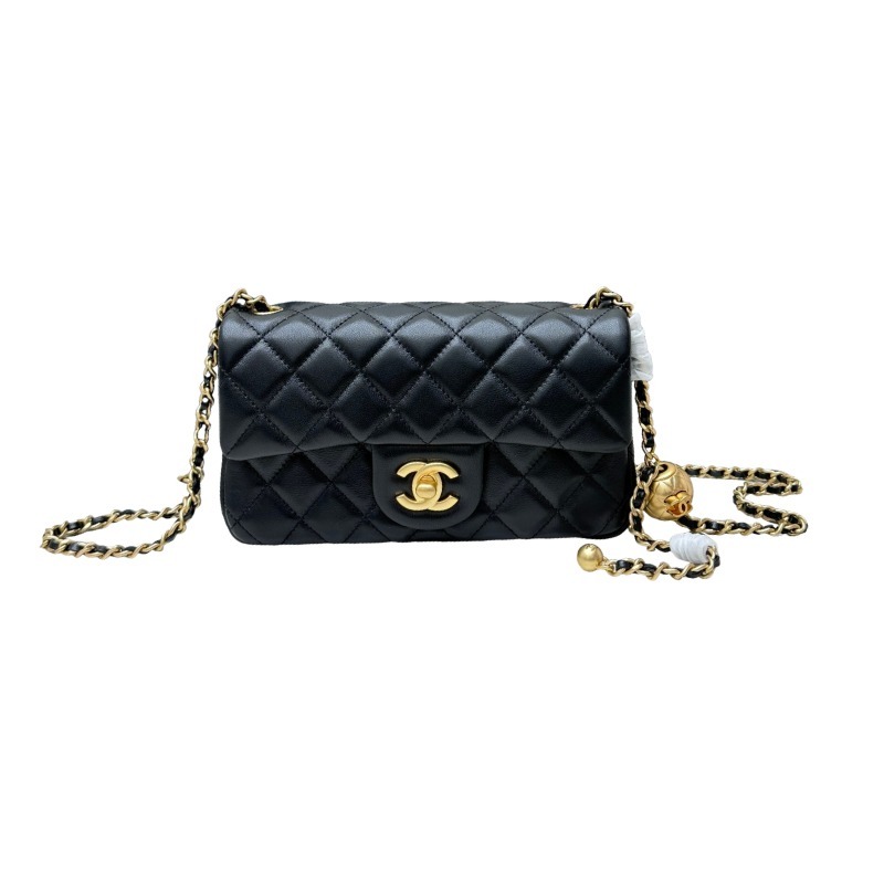 This is a small Chanel Classic Flap bag with a pearl crush charm (often referred to as the "Golden Ball CF") from Chanel, featuring the brand's iconic lambskin and diamond-quilted pattern.