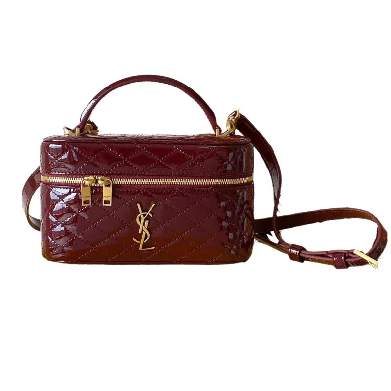 This is the YSL burgundy patent leather vanity bag with quilted stitching, featuring a top handle and crossbody strap.