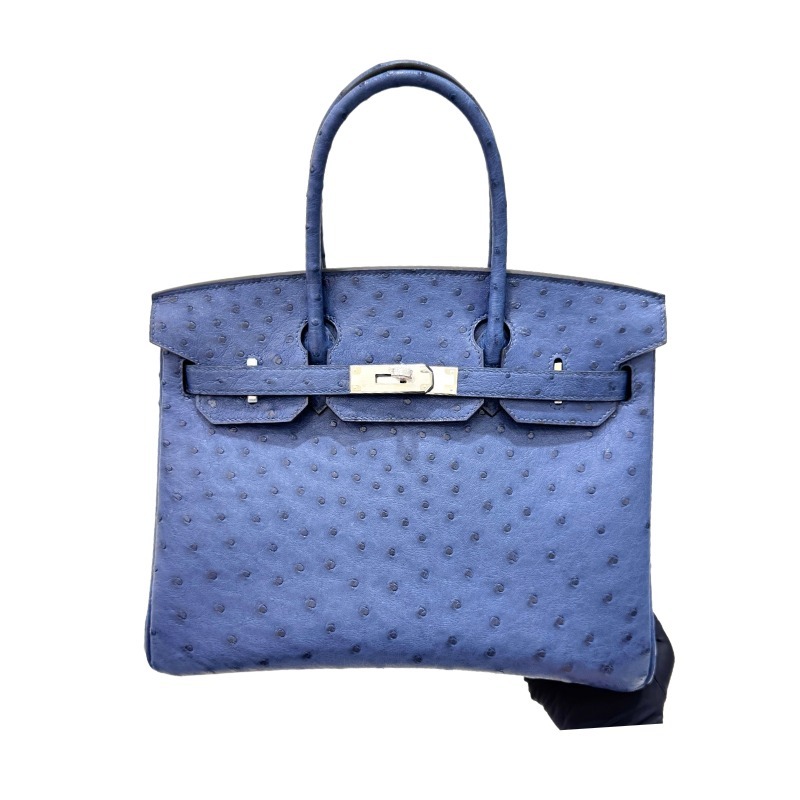 The Hermès Birkin 30 Ostrich Leather Handbag—featuring a Deep Sea Blue hue paired with silver hardware—stands as one of the brand's flagship models crafted from its most exclusive and rare leathers.