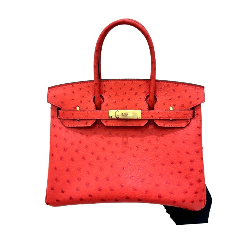 The Hermès Birkin 30 Ostrich Handbag—featuring a striking true red hue (reminiscent of tomato or flame red) paired with gold hardware—stands as one of the brand's most instantly recognizable and coveted flagship models crafted from exotic leather.