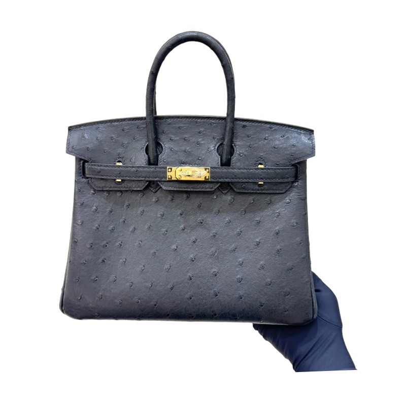 The Hermès Birkin 30 handbag in ostrich leather—featuring the classic black hue paired with gold hardware—is recognized by the brand as one of its "kings of value retention" among exotic skins.