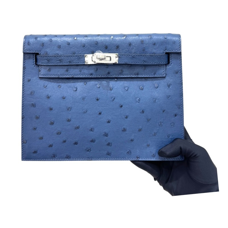 The Hermès Kelly Danse handbag in ostrich leather—rendered in a misty blue hue (variously described as Sailor Blue or Atlantic Blue) and accented with silver hardware—stands as an iconic exemplar of cool, sophisticated elegance within the brand's rare lea