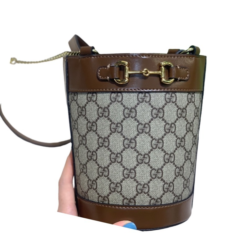 The Gucci Horsebit 1955 mini bucket bag is a popular style in the 1955 collection, combining retro charm with a playful touch.
